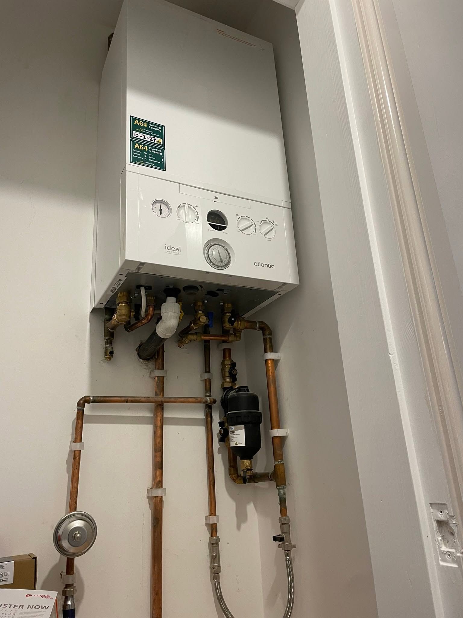 A64 wall-mounted boiler installation with copper connections