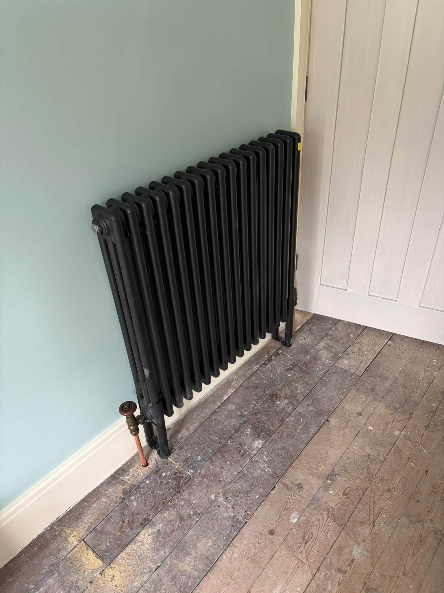 Black column radiator installed by A64 Plumbing in York